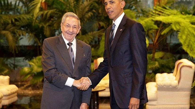 Cuban President Raul Castro, left, shakes hands with US President Barack Obama during a meeting in Revolution Palace. Cuban President Raul Castro, left, shakes hands with US President Barack Obama during a meeting in Revolution Palace.