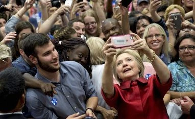 Hillary Clinton presidential campaign hit by FBI email probe 11 days before election Democratic presidential candidate Hillary Clinton takes photos with supporters in the audience after speaking during a campaign event at Carl Hayden Community High School in Phoenix
