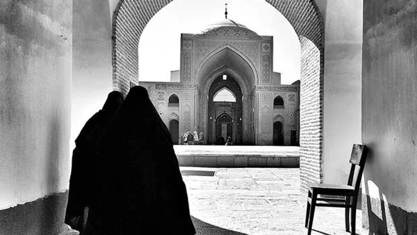 Two women at the Jama Masjid in Yazd, Iran Two women at the Jama Masjid in Yazd, Iran