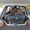 A mechanic repairs a pipe of a LPG tank installed in a car outside his workshop in Ahmedabad. Photo: Reuters