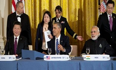 At dinner with Obama, Modi urges global unity against terror Seated from left, Chinese President Xi Jinping, President Barack Obama, and India's Prime Minister Narendra Modi, gather for a working dinner with heads of delegations of the Nuclear Security Summit in the East Room of the White House in Washington