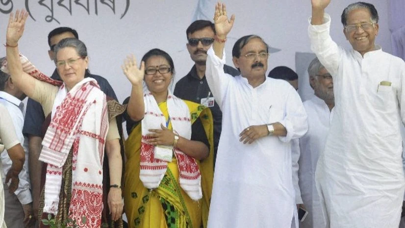 Congress president Sonia Gandhi (L), Assam Chief Minister Tarun Gogoi (R), APCC president Anjan Dutta (2nd R) and Congress candidate from Amguri Assembly constituency Ankita Dutta wave at the crowd at an election rally in Amguri, Assam Congress president Sonia Gandhi (L), Assam Chief Minister Tarun Gogoi (R), APCC president Anjan Dutta (2nd R) and Congress candidate from Amguri Assembly constituency Ankita Dutta wave at the crowd at an election rally in Amguri, Assam