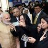 Prime Minister Narendra Modi poses for a selfie with IT professionals working in TCS All Women IT &amp; ITES Center during his visit to the Complex in Riyadh, Saudi Arabia