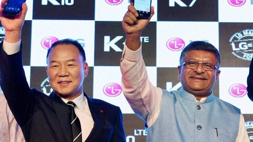Union Minister of Communications & Information Technology Ravi Shankar Prasad with Telecom Secretary J S Deepak and Managing director, LG Electronics India, Kim Ki Wan, at the launch of LG's first made in India mobile phones K7 & K10 in New Union Minister of Communications & Information Technology Ravi Shankar Prasad with Telecom Secretary J S Deepak and Managing director, LG Electronics India, Kim Ki Wan, at the launch of LG's first made in India mobile phones K7 & K10 in New