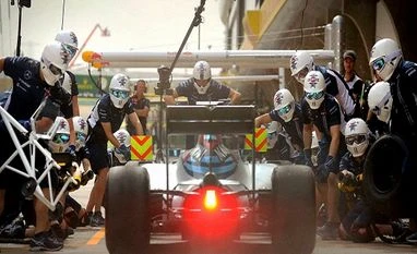 No substance to Carlos Slim takeover rumours: Force India Crew members wait to perform a pit stop on the car of Williams driver Felipe Massa of Brazil during the second practice session for the Chinese Formula One Grand Prix at the Shanghai International Circuit in China. (Photo: AP/PTI)