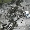 In this aerial photo, a parking lot is seen damaged by the earthquake in Minamiaso town, Kumamoto prefecture, southern Japan. Photo: AP/PTI