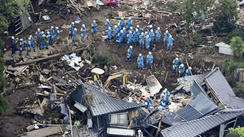 Rescue workers conduct a search and rescue operation at a house that collapsed during a landslide triggered by earthquakes in southern Japan: Reuters Rescue workers conduct a search and rescue operation at a house that collapsed during a landslide triggered by earthquakes in southern Japan: Reuters