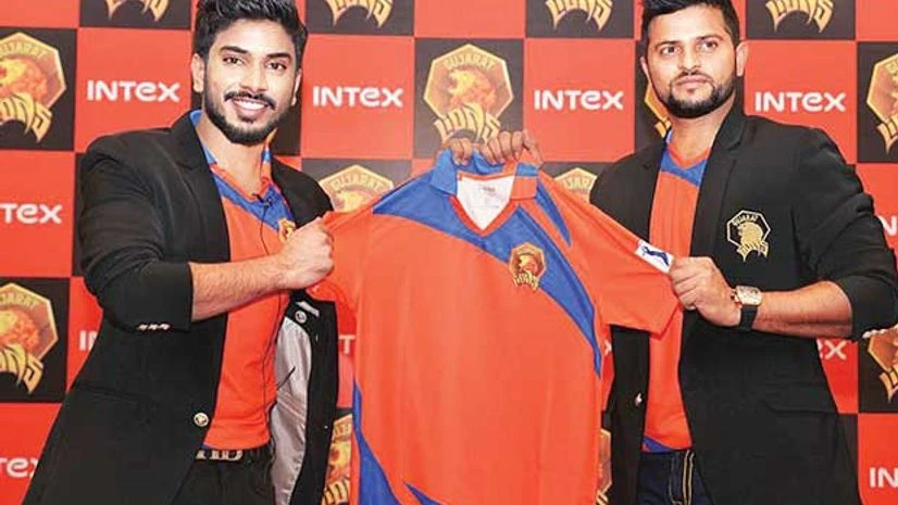 Gujarat Lions owner Keshav Bansal (left) and captain Suresh Raina unveil the team jersey Gujarat Lions owner Keshav Bansal (left) and captain Suresh Raina unveil the team jersey