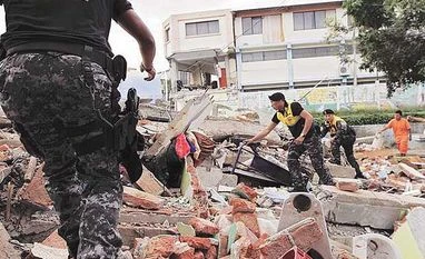 Quake-hit Ecuador gets $364 million in emergency support from IMF Red Cross members, military and police officers work at a collapsed area after an earthquake struck off Ecuador's Pacific coast on Sunday