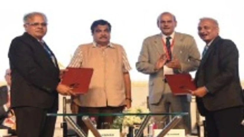 BEML and DCI Ltd officials sign the MoU in the presence of Nitin Gadkari BEML and DCI Ltd officials sign the MoU in the presence of Nitin Gadkari
