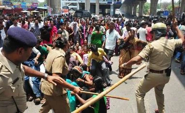 Centre aborts PF curbs after workers' rage Bengaluru, Protest, EPF, Lathicharge