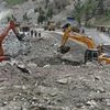 Excavators are used to dig earth at the dam site of Kishanganga power project in Gurez, 160 km (99 miles) north of Srinagar
