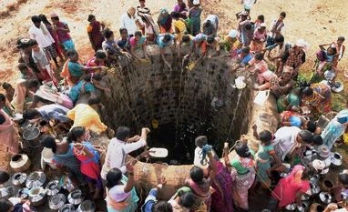 Maharashtra govt to declare drought in over 29,000 villages Villagers gather to collect water from a well that was filled by a tanker in Kasara, Maharashtra