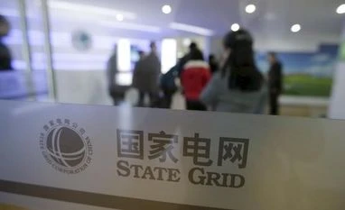 State Grid, Enel place bids for Brazil's Renova stake: Sources Staff members walk into a wind and solar energy storage and transmission power station of State Grid Corporation of China, in Zhangjiakou of Hebei province, China. Photo: REUTERS/Jason Lee/Files