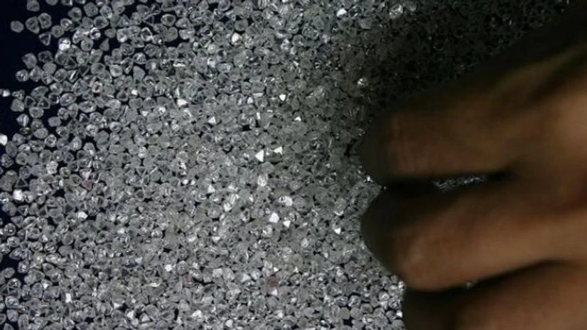 An employee sifts diamonds at a diamond cutting and polishing factory in Surat in Gujarat An employee sifts diamonds at a diamond cutting and polishing factory in Surat in Gujarat