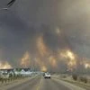 Canada fire 'out of control,' doubles in size