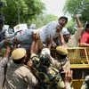 Aam Aadmi Party workers defying police restrictions during a protest against Agustawestland scam at Jantar Mantar in New Delhi on Saturday. PTI photo