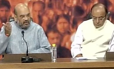 BJP makes PM Modi's degrees public, demands apology from Kejriwal Amit Shah and Arun Jaitley, as they announce that PM Modi's educational degrees will be available in public domain (Photo: ANI)