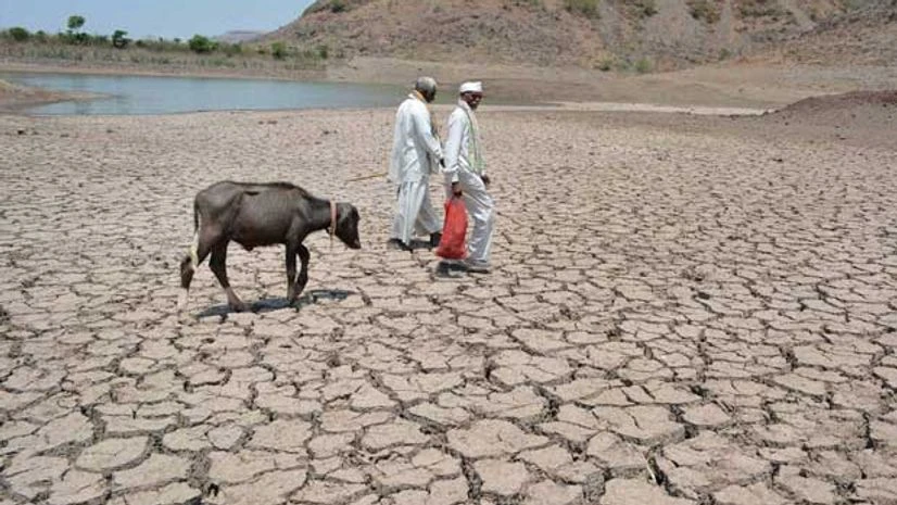 Villagers walk on dry bed of Mervewadi lake in Karad, Maharashtra on Wednesday, May 11, 2016 PTI Villagers walk on dry bed of Mervewadi lake in Karad, Maharashtra on Wednesday, May 11, 2016 PTI