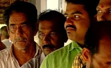 Kerala Assembly polls: 57.5% voter turnout recorded till 3 pm People stand in queue as they wait to caste their vote for the Kerala assembly polls. (Photo: ANI)