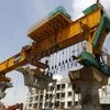 abourers work at the site of metro railway flyover under construction in Ahmedabad