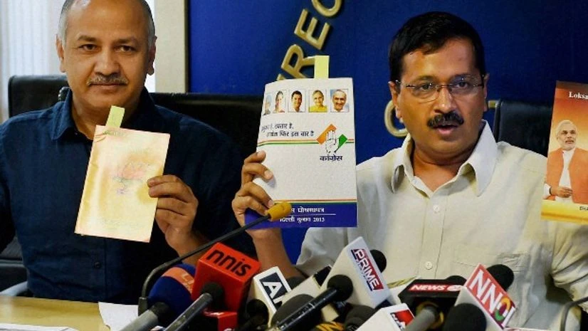 Delhi Chief Minister Arvind Kejriwal with Dy CM Manish Sisodia showing Congress and BJP party manifestos at a press conference at Delhi Secretariat on Wednesday. BJP and Congress in their manifestos have also promised for full statehood to the Delhi Delhi Chief Minister Arvind Kejriwal with Dy CM Manish Sisodia showing Congress and BJP party manifestos at a press conference at Delhi Secretariat on Wednesday. BJP and Congress in their manifestos have also promised for full statehood to the Delhi