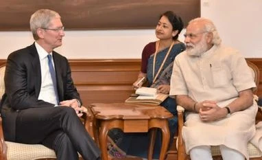 Apple CEO meets PM, launches updated 'Modi app' Apple CEO Tim Cook calls on PM Narendra Modi in New Delhi. Photo: ANI
