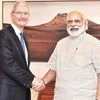 Apple CEO Tim Cook (left) with Prime Minister Narendra Modi in New Delhi on Saturday. Cook also launched an updated version of the 'Narendra Modi Mobile App'