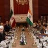 Prime Minister Narendra Modi talks with President of Iran Hassan Rouhani, in Jomhouri Building, at Saadabad Palace, in Tehran, Iran