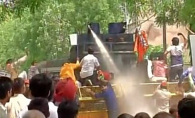 BJP, Congress workers protest against erratic power, water supply water cannon, protest