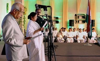Mamata sworn in amid Federal Front buzz West Bengal Governor Keshari Nath Tripathy administers the oath of secrecy to West Bengal Chief Minister Mamata Banerjee during swearing-in ceremony in Kolkata. PTI