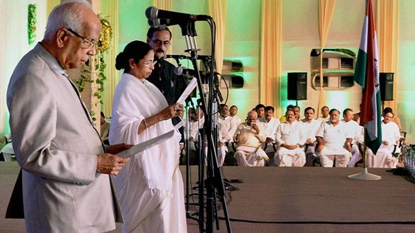 West Bengal Governor Keshari Nath Tripathy administers the oath of secrecy to West Bengal Chief Minister Mamata Banerjee during swearing-in ceremony in Kolkata. PTI West Bengal Governor Keshari Nath Tripathy administers the oath of secrecy to West Bengal Chief Minister Mamata Banerjee during swearing-in ceremony in Kolkata. PTI