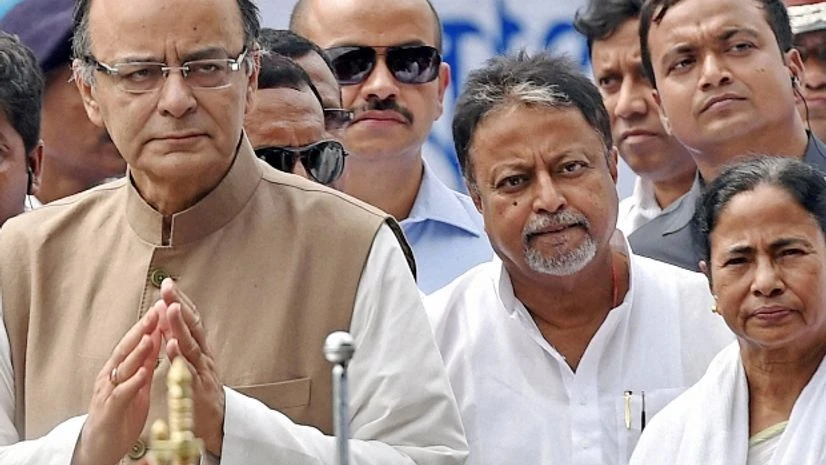 West Bengal Chief Minister Mamata Banerjee with Union Finance Minister Arun jaitley and TMC Leader Mukul Roy after taking oath in Kolkata West Bengal Chief Minister Mamata Banerjee with Union Finance Minister Arun jaitley and TMC Leader Mukul Roy after taking oath in Kolkata