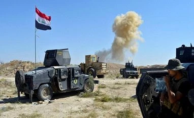 Iraqi forces free town near IS stronghold of Fallujah Smoke rises as Iraqi counterterrorism forces face off with Islamic State militants on the southern edge of Fallujah, Iraq on Tuesday, May 31, 2016 a day after launching an operation of the militant-held city with the help of U.S.-led coalition airstr