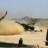 Iraqi security forces and allied Popular Mobilization forces fire artillery during fight against Islamic State militants in Fallujah, Iraq