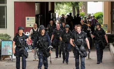 Mainak Sarkar, an alumnus IIT-Kgp knows little about Los Angeles Police officers walk by the Mathematical Sciences Building on the UCLA campus after a fatal shooting at the University of California, Los Angeles, Wednesday, June 1, 2016
