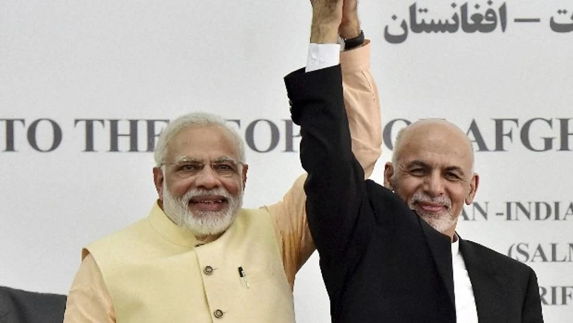 Prime Minister Narendra Modi and Afghan President Ashraf Ghani raise each other's hands after inaugurating Afghan-India Friendship Dam in Herat, Afghanistan. PTI Photo by Kamal Kishore Prime Minister Narendra Modi and Afghan President Ashraf Ghani raise each other's hands after inaugurating Afghan-India Friendship Dam in Herat, Afghanistan. PTI Photo by Kamal Kishore