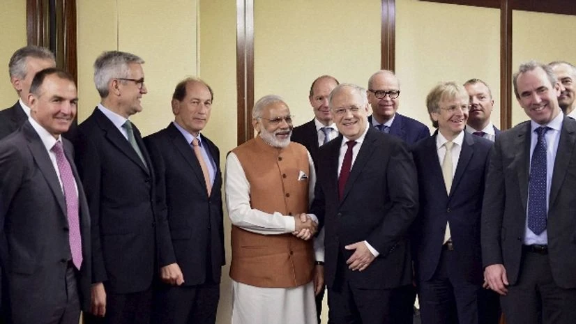 Prime Minister Narendra Modi and Switzerland's President Johann Schneider-Ammann, pose with business men at a meeting in Geneva, Switzerland Prime Minister Narendra Modi and Switzerland's President Johann Schneider-Ammann, pose with business men at a meeting in Geneva, Switzerland