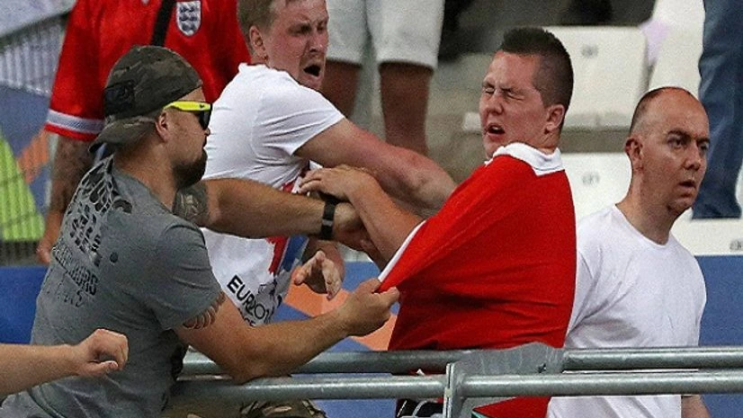 Russian supporters attack an England fan at the end of the Euro 2016 Group B soccer match between England and Russia at the Velodrome stadium in Marseille, France Russian supporters attack an England fan at the end of the Euro 2016 Group B soccer match between England and Russia at the Velodrome stadium in Marseille, France