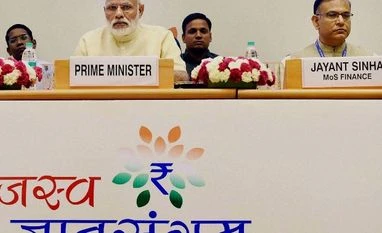 PM Modi asks officials to double taxpayer base to 10 crore Prime Minister Narendra Modi with Minister of State for Finance Jayant Sinha during the Inaugural Session of the two-day 'Annual Conference of Tax Administrators 2016'