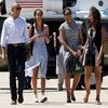 President Barack Obama, Malia Obama, Michelle Obama and Sasha Obama walk to board Air Force One after leaving Yosemite National Park via helicopter after visiting the park to celebrate the 100th anniversary of the creation of US national park system.