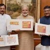 Prime Minister, Narendra Modi releasing the commemorative postage stamps on Surya Namaskara, ahead of the International Day of Yoga, in New Delhi on Monday. Union Minister for Communications &amp; Information Technology, Ravi Shankar Prasad and  MoS 