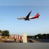 A SpiceJet passenger aircraft prepares to land at Sardar Vallabhbhai Patel international airport in Ahmedabad