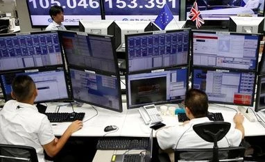 US Fed, BoJ fire up markets. How long will the rally last? Employees of a foreign exchange trading company work in front of monitors displaying television news on Britain's EU referendum and the Japanese yen's exchange rate against British pound (C) and the U.S. dollar (L) in Tokyo, Japan. Photo: Reuters