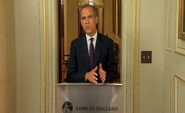 BoE surprises markets, keeps rates on hold In this image taken from TV, the Governor of the Bank of England, Mark Carney makes a statement in central London.