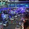 Security and rescue personnel gather outside Istanbul's Ataturk airport. Two explosions have rocked the airport killing several people and wounding scores of others, Turkey's justice minister and another official said.