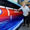 Defence Minister Manohar Parrikar takes a look of a model of the heavy weight anti-submarine torpedo 'Varunastra' after it was handed over to the Indian Navy in New Delhi.