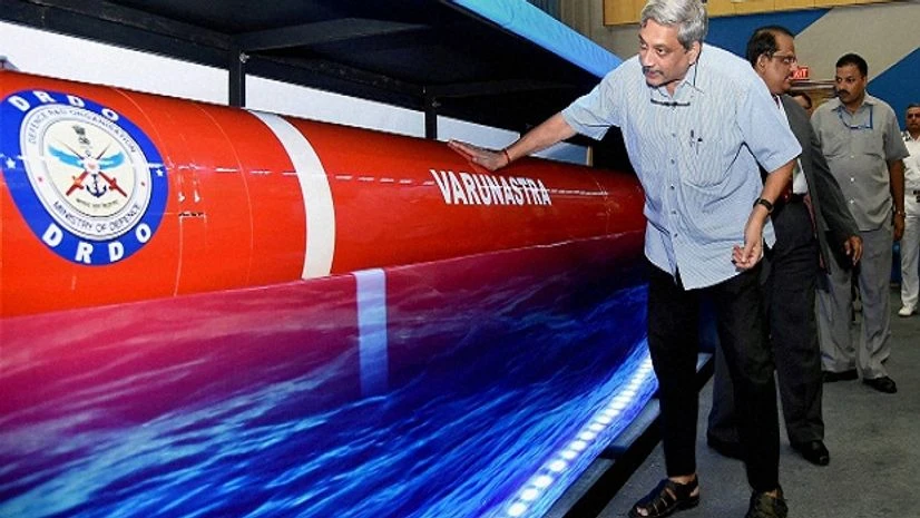 Defence Minister Manohar Parrikar takes a look of a model of the heavy weight anti-submarine torpedo 'Varunastra' after it was handed over to the Indian Navy in New Delhi. Defence Minister Manohar Parrikar takes a look of a model of the heavy weight anti-submarine torpedo 'Varunastra' after it was handed over to the Indian Navy in New Delhi.