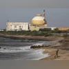 A policeman walks on a beach near Kudankulam nuclear power project (photo: Reuters)