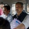 CBI officials take away Delhi Chief Minister Arvind Kejriwal's Principal Secretary Rajendra Kumar after producing him at Patiala House court in a corruption case, in New Delhi